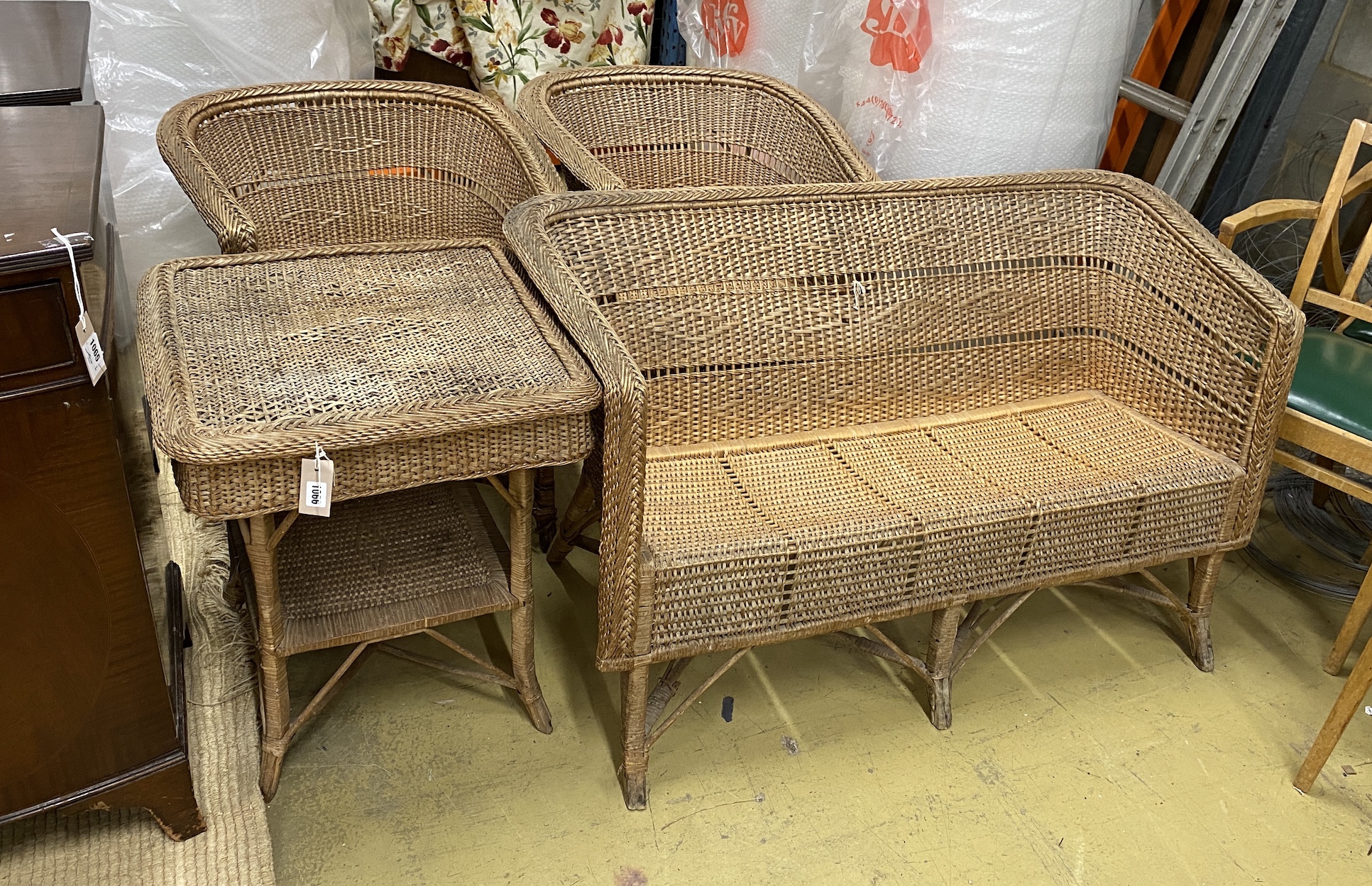 A vintage wicker four piece conservatory suite, settee length 122cm, depth 56cm, height 70cm